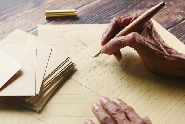 Close-up image of diverse hands exchanging documents, such as IDs and forms, over a wooden table. This emphasizes the importance of having the right documents ready when applying for governmental and social services. The lighting is soft, creating an atmosphere of trust and collaboration.
