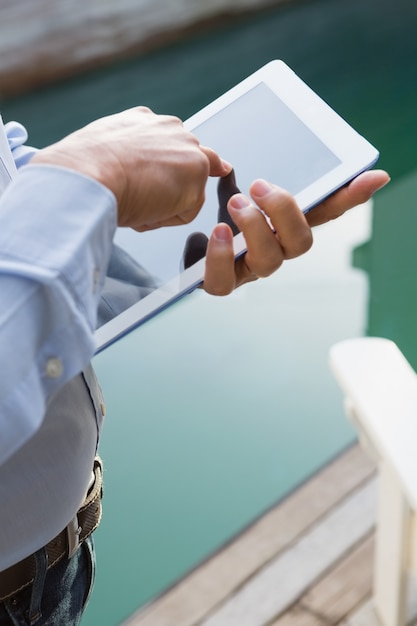 An Android smartphone showing the steps to download the Carteira de Trabalho Digital app from the Google Play Store, including the search results for 