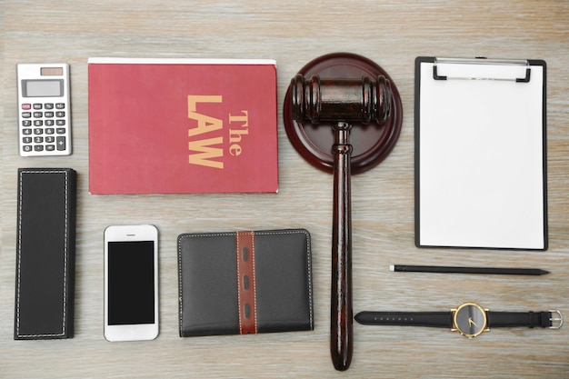 A gavel and a set of legal documents placed on a table, representing the legal aspects of eSocial Doméstico for domestic employers. The image evokes a sense of compliance and the importance of staying informed about legislation.