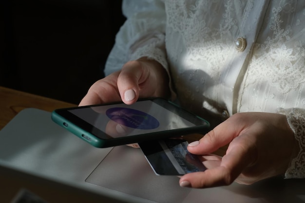A close-up of a smartphone displaying a banking app, with a visible option to scan or enter a barcode for payment. The screen also shows partial details of a property tax bill (IPTU). Focus on the app's intuitive interface.