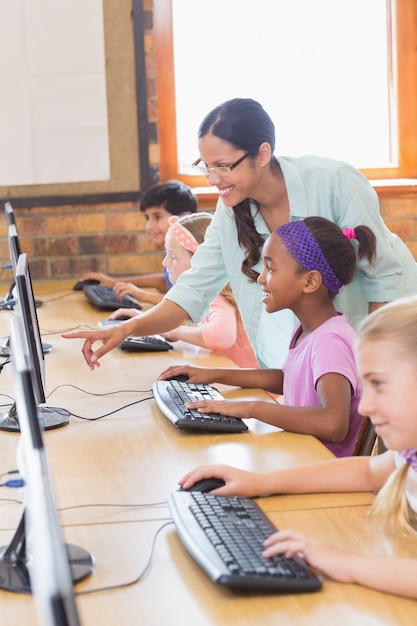 A group of volunteers teaching coding to children in a community center. The children are engaged and excited, learning how to create their own games and apps. The scene showcases the potential of technology to empower young people.