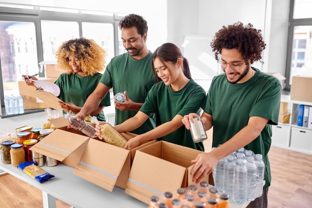 A group of volunteers sorting and packing donated food items in a food bank, showcasing the organized effort to redistribute surplus food to those in need. The image highlights the positive impact of food banks on reducing waste and addressing food insecurity.