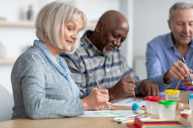 A diverse group of senior citizens participating in a financial literacy workshop, learning about managing their INSS benefits and planning for retirement. The scene is set in a community center, promoting inclusivity and empowerment.