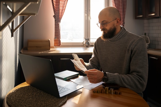 A person sitting at a desk with a laptop, filling out an online tax form. The image should convey a sense of organization and focus, representing the process of filing income taxes in 2025.