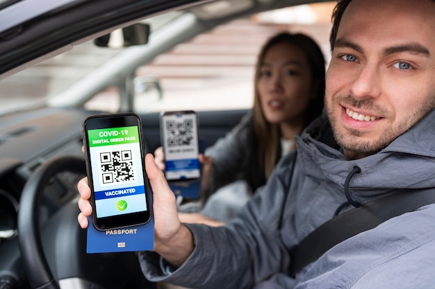 A smartphone displaying a digital driver's license app. The app shows the driver's photo, name, and license details, along with security features like a QR code and a digital watermark.