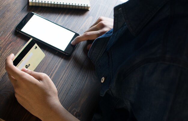A hand taking a screenshot of a suspicious email on a smartphone, emphasizing the importance of evidence collection for cyber crime reporting.
