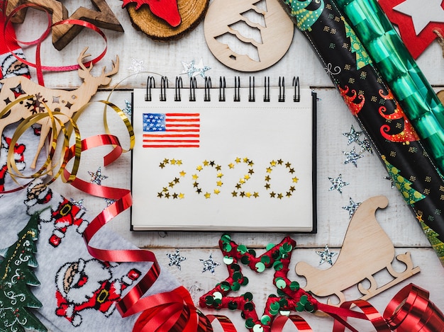 A calendar for the year 2025, clearly showing all the national holidays marked with different colors and symbols representing each holiday. The calendar is hanging on a brightly colored wall, and there's a close-up view to highlight the dates and their corresponding celebrations.