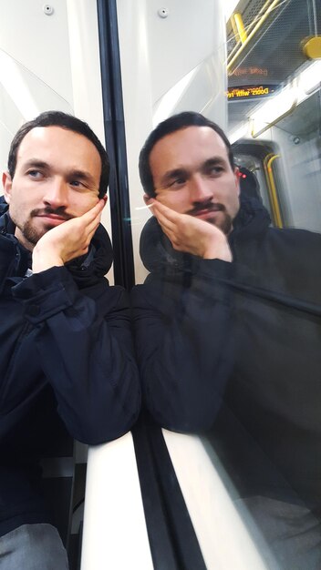 A split image showing two scenarios: on one side, a person happily using public transportation and, on the other side, a person looking stressed while filling up their car at a gas station with the increased price displayed.