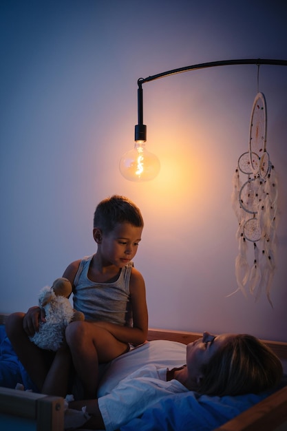 A family switching off lights in different rooms of their home, emphasizing energy conservation practices for children.