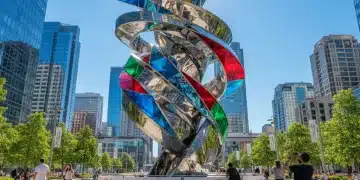 New Public Art Installations 2026: Cultural Significance Unveiled Dynamic abstract public art installation in a city square, reflecting sunlight